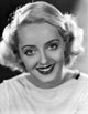 Bette Davis smiling portrait photo print on black background