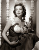 Gene Tierney holding a rose photo print.
