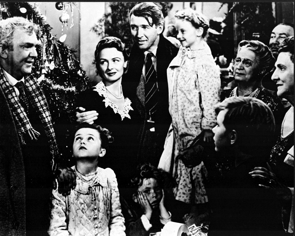 Black and white photo print of James Stewart and Donna Reed with children from It's A Wonderful Life