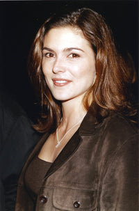 Paige Turco posed in a black coat photo print