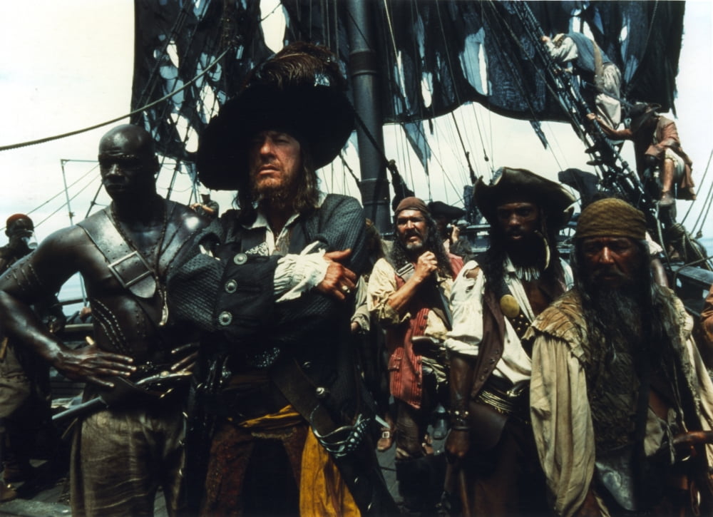 Geoffrey Rush as Hector Barbossa photo print in dynamic pose.