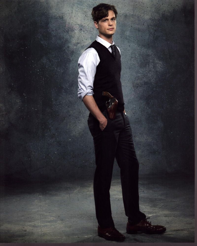 Matthew Gray Gubler photo print from Criminal Minds with hands in pockets and gun in holster.
