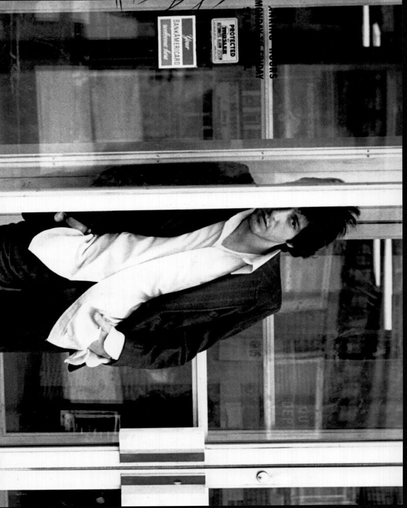 Al Pacino leaning on glass wall black and white photo print from Dog Day Afternoon.