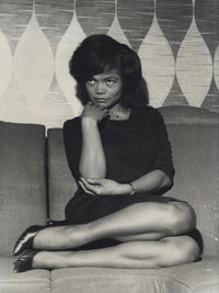 Eartha Kitt glamorous photo print lounging on a sofa.