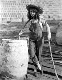 Fay Wray photo print filling up drum with water in jumper