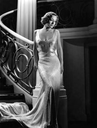 Joan Crawford wearing an evening gown designed by Adrian in 1935 photo print.