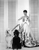 Audrey Hepburn Walking Dogs Photo Print capturing classic Hollywood elegance.