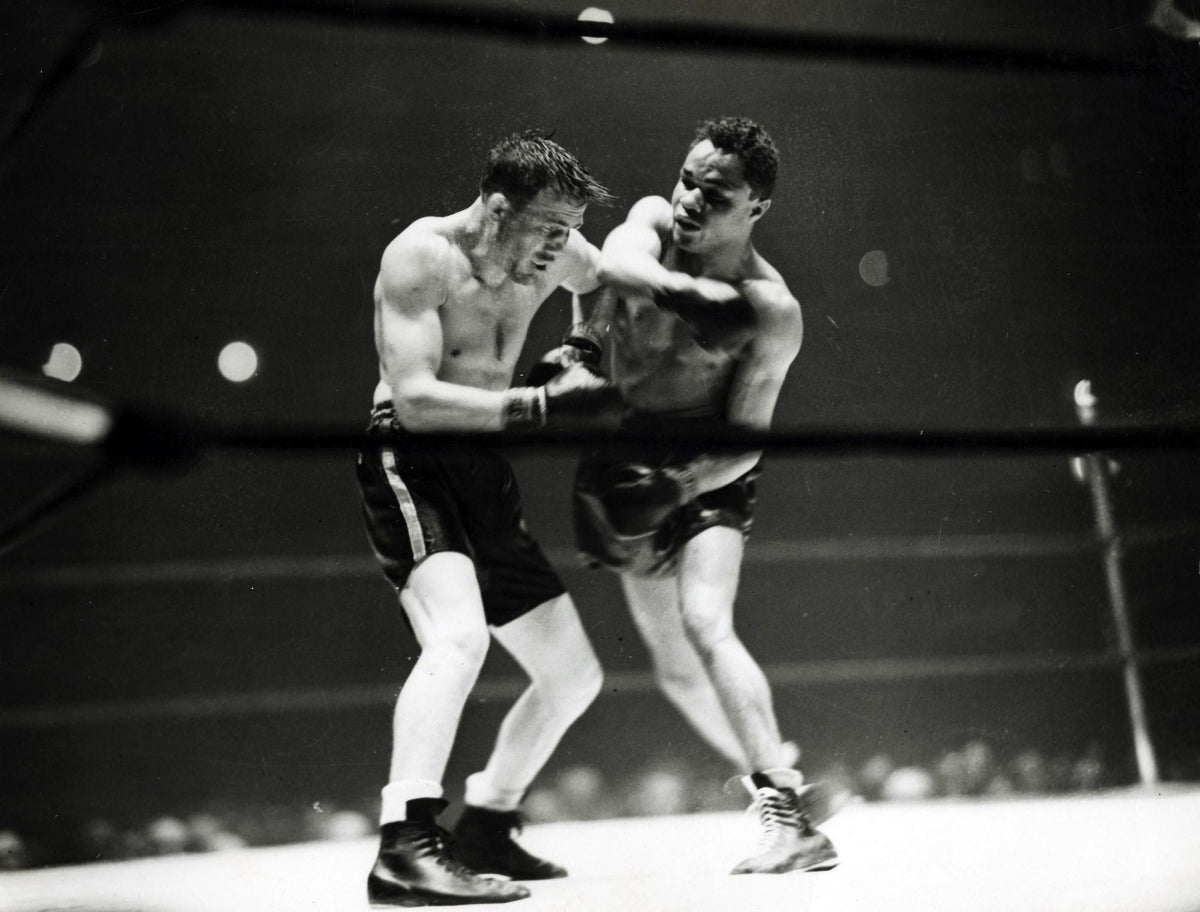 Joe Louis Boxing Match Photo Print showcasing the legendary boxer in action.