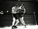 Joe Louis Boxing Match Photo Print showcasing the legendary boxer in action.