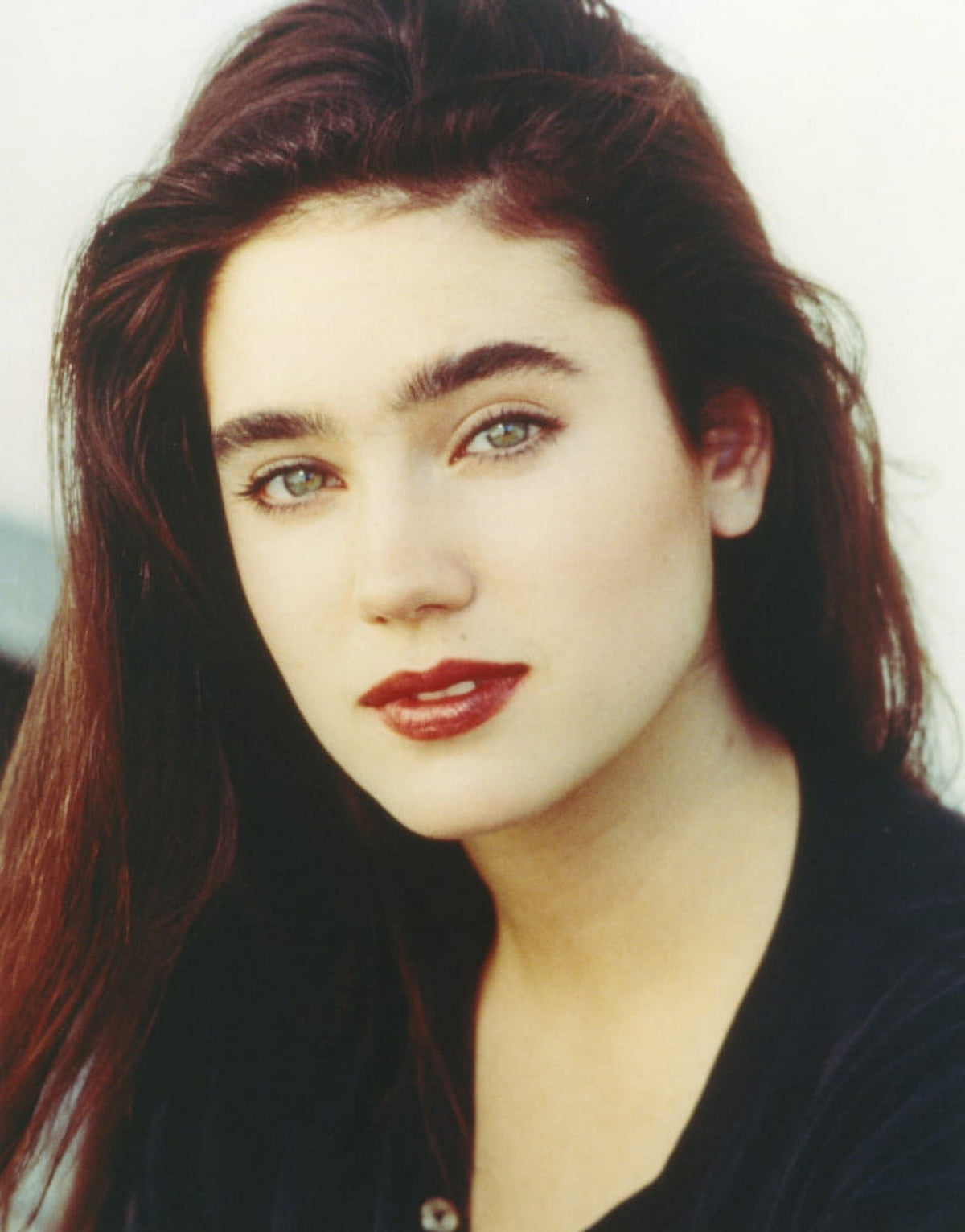Close-up portrait photo of Jennifer Connelly on a white background.