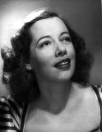 Imogene Coca photo print in a printed blouse looking up, available in multiple sizes.
