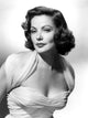Gene Tierney photo print in a white ruffle top with sheer shoulder straps.