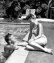 Natalie Wood and Tab Hunter relaxing poolside photo print