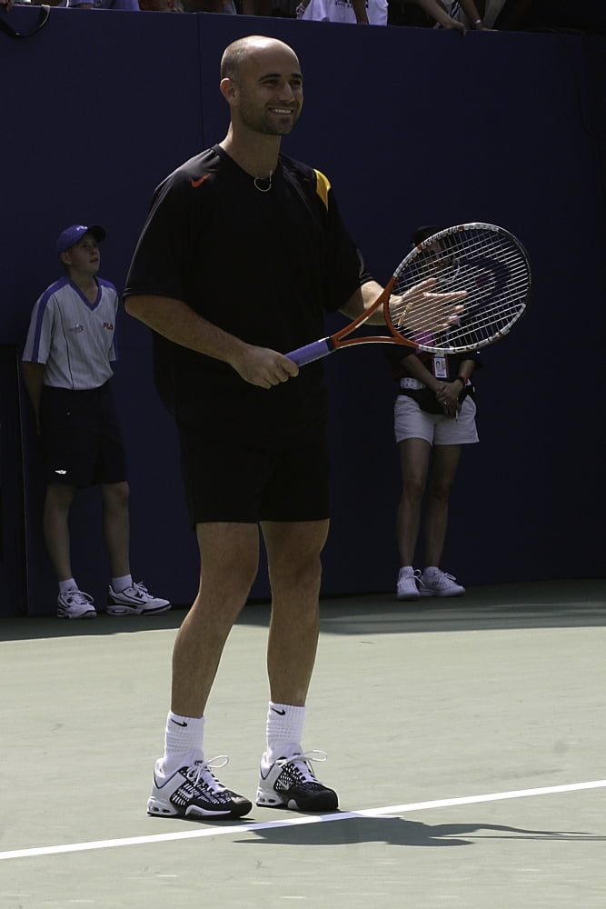 Andre Agassi tennis action photo print showcasing dynamic movement.