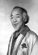 Pat Morita wearing a satin robe photo print