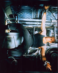 Vin Diesel shackled in Pitch Black photo print, showcasing intense action.