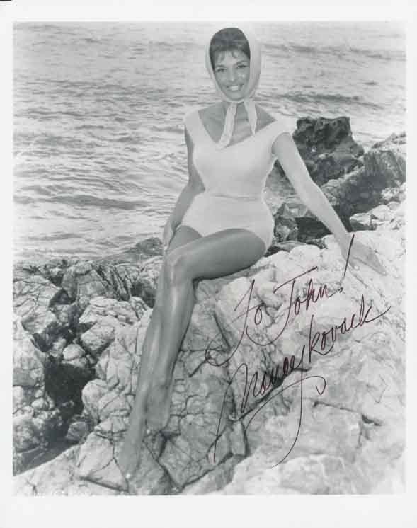Nancy Kovack signed photo print featuring a head scarf in 8x10 size.