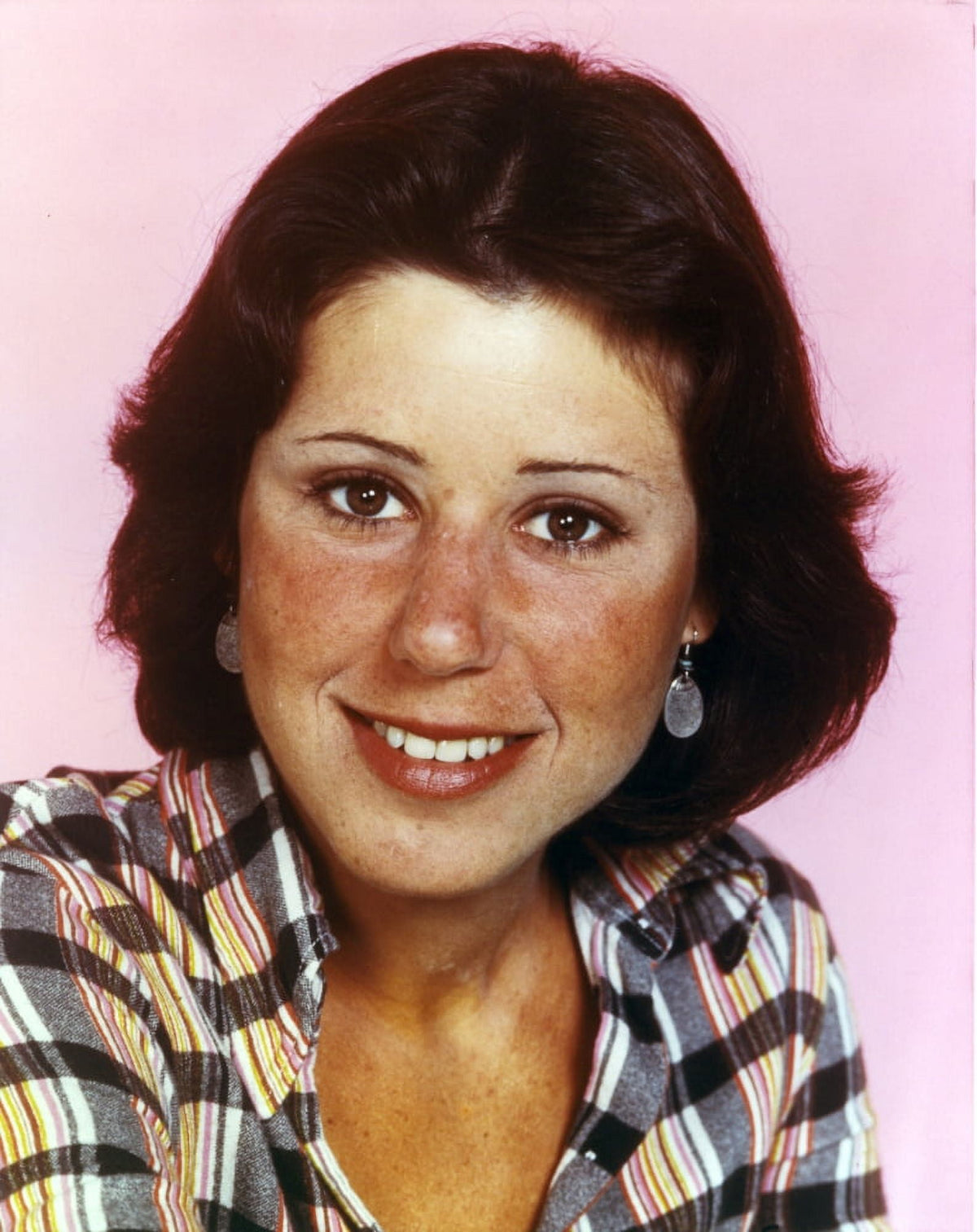 Close-up portrait photo print of Julie Kavner in checkered outfit