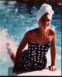Brooke Shields splashing her feet in a polka dot bathing suit photo print.