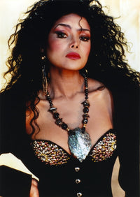 Latoya Jackson elegant photo print in black dress with necklace.