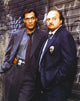 NYPD Blue standing posed in tuxedo with badge photo print.