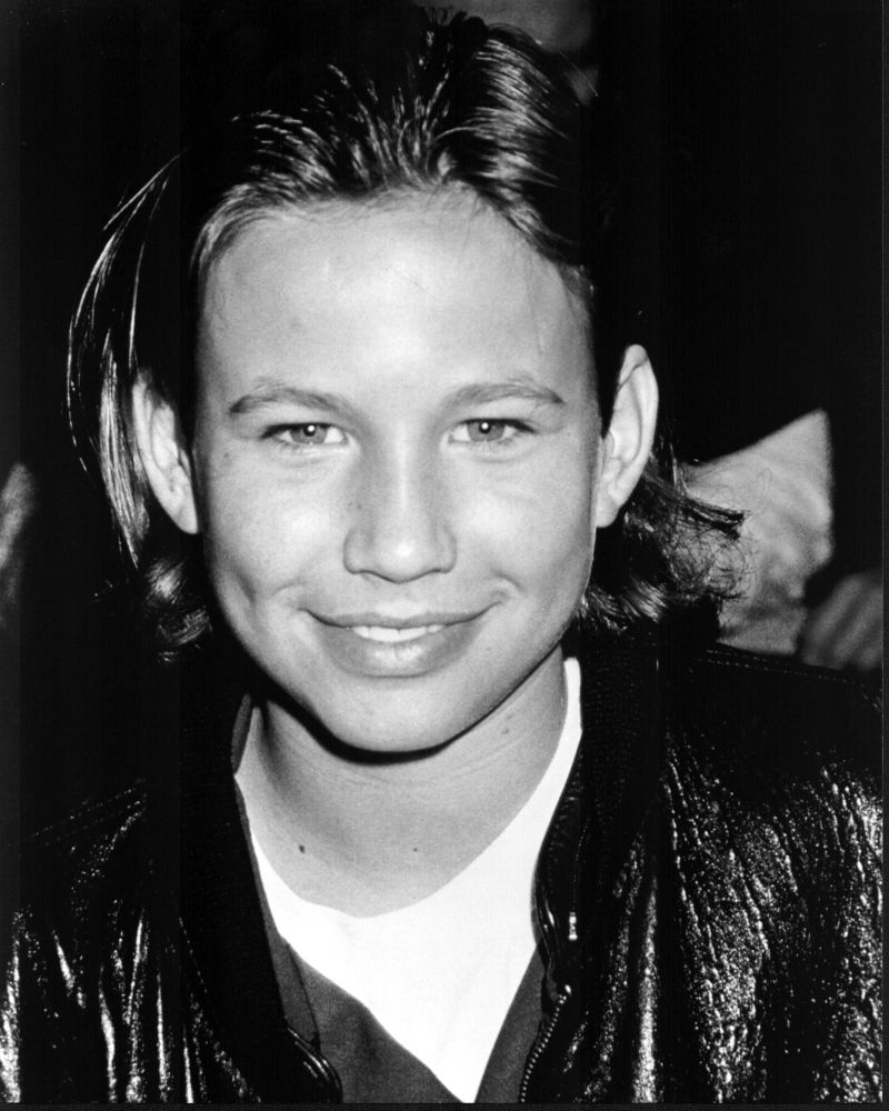 Black and white photo print of Jonathan Taylor Thomas in leather jacket