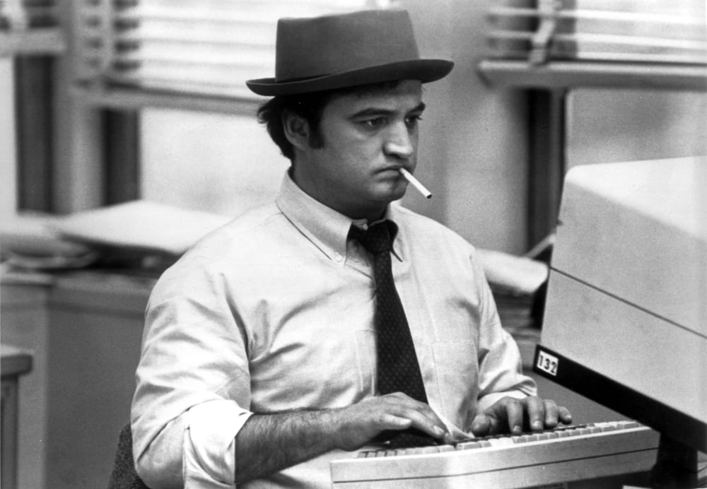 John Belushi film still photo print featuring classic cinema moment