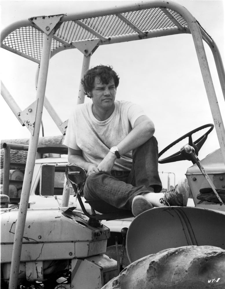 Joe Don Baker photo print in a tractor, capturing a classic cinematic moment.