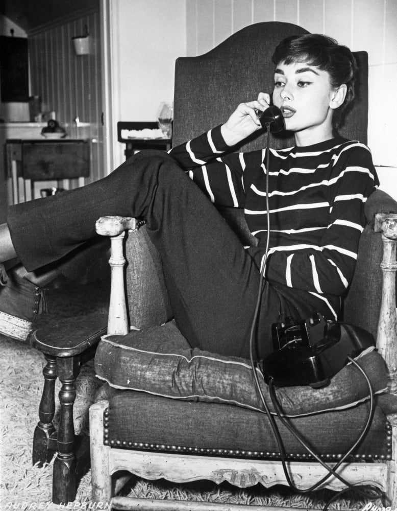 Audrey Hepburn classic photo print in striped attire on the phone