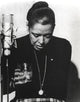 Billie Holiday Looking Down in Black Dress Photo Print