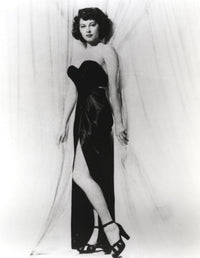 Classic portrait of Ava Gardner in black gown and stiletto heels