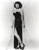 Classic portrait of Ava Gardner in black gown and stiletto heels