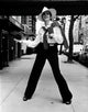 Liza Minnelli wearing a trilby on a sidewalk photo print