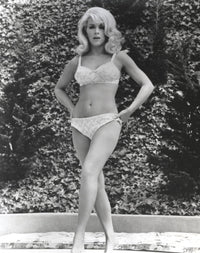 Black and white photo print of Stella Stevens in bikini posing with hands on hips.