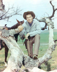 Laramie cast posed on a tree branch in cowboy outfits photo print