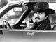 Burt Reynolds film still photo print featuring iconic car scene.