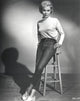 Janet Leigh photo print in elegant pose wearing white and black attire.