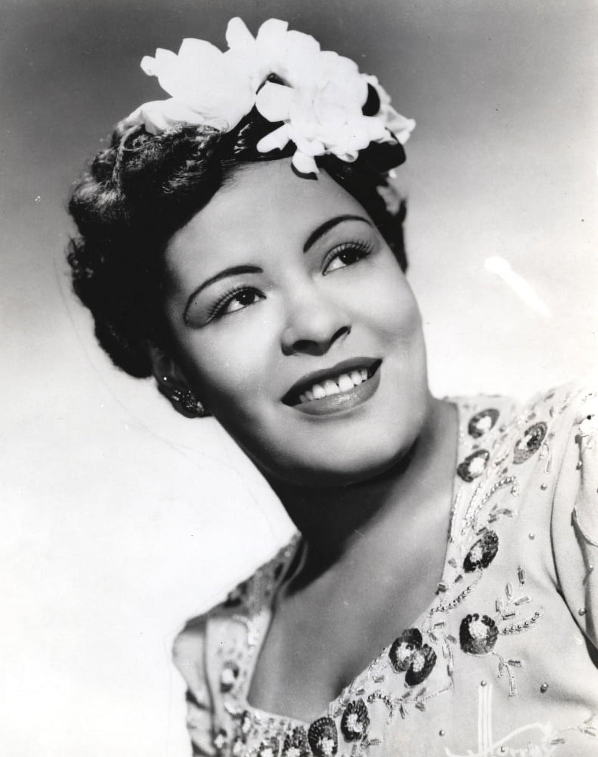 Billie Holiday smiling close-up portrait with floral accessories photo print