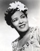 Billie Holiday smiling close-up portrait with floral accessories photo print