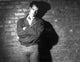 Tom Hanks photo print with arms crossed in front of a brick wall, iconic actor portrait.