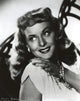 Close-up portrait photo print of Paulette Goddard in a white dress.