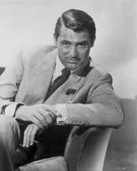 Cary Grant seated in a formal suit photo print