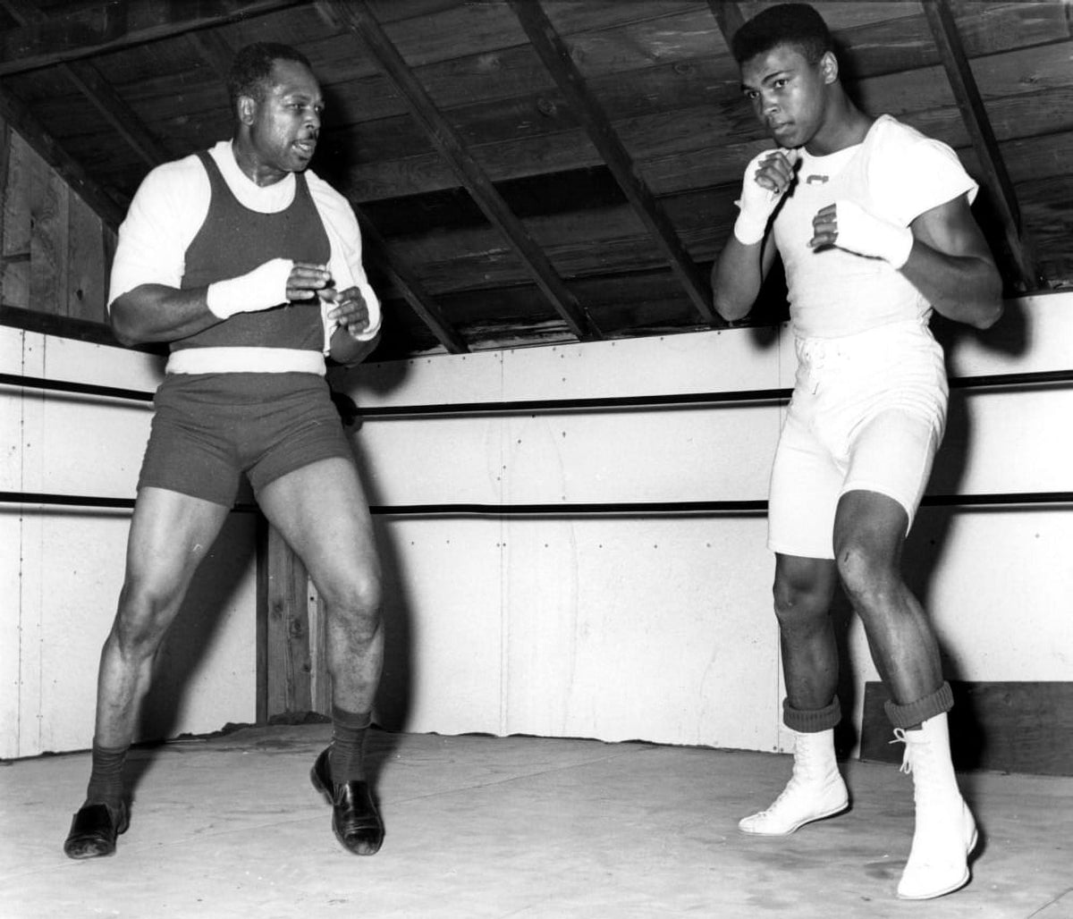 Muhammad Ali training with Archie Moore photo print showcasing boxing greatness.