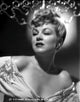Claire Trevor posed in floral dress classic portrait photo print.