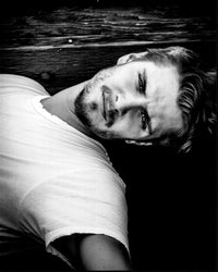 Black and white photo print of Luke Grimes, available in multiple sizes.