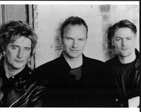 Black and white photo print of Rod Stewart, Sting, and Bryan Adams.