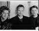 Black and white photo print of Rod Stewart, Sting, and Bryan Adams.