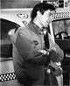 Robert De Niro leaning on a taxi cab photo print