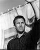 Black and white photo print of Kevin Costner waving with arm up.