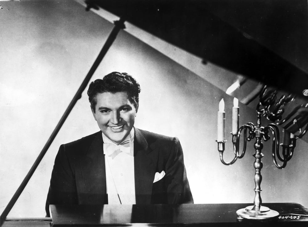 Liberace photo print showcasing the iconic performer in a classic pose.